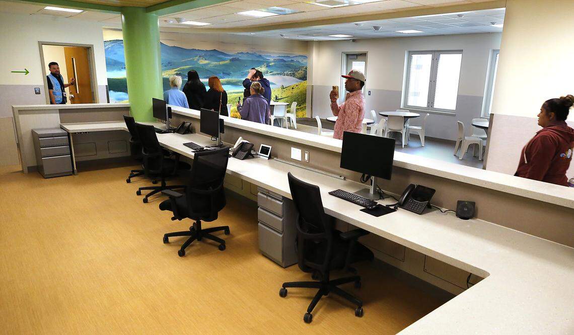 Community members take a tour through the Columbia Valley Center for Recovery in downtown Kennewick following a grand opening and ribbon cutting ceremony.